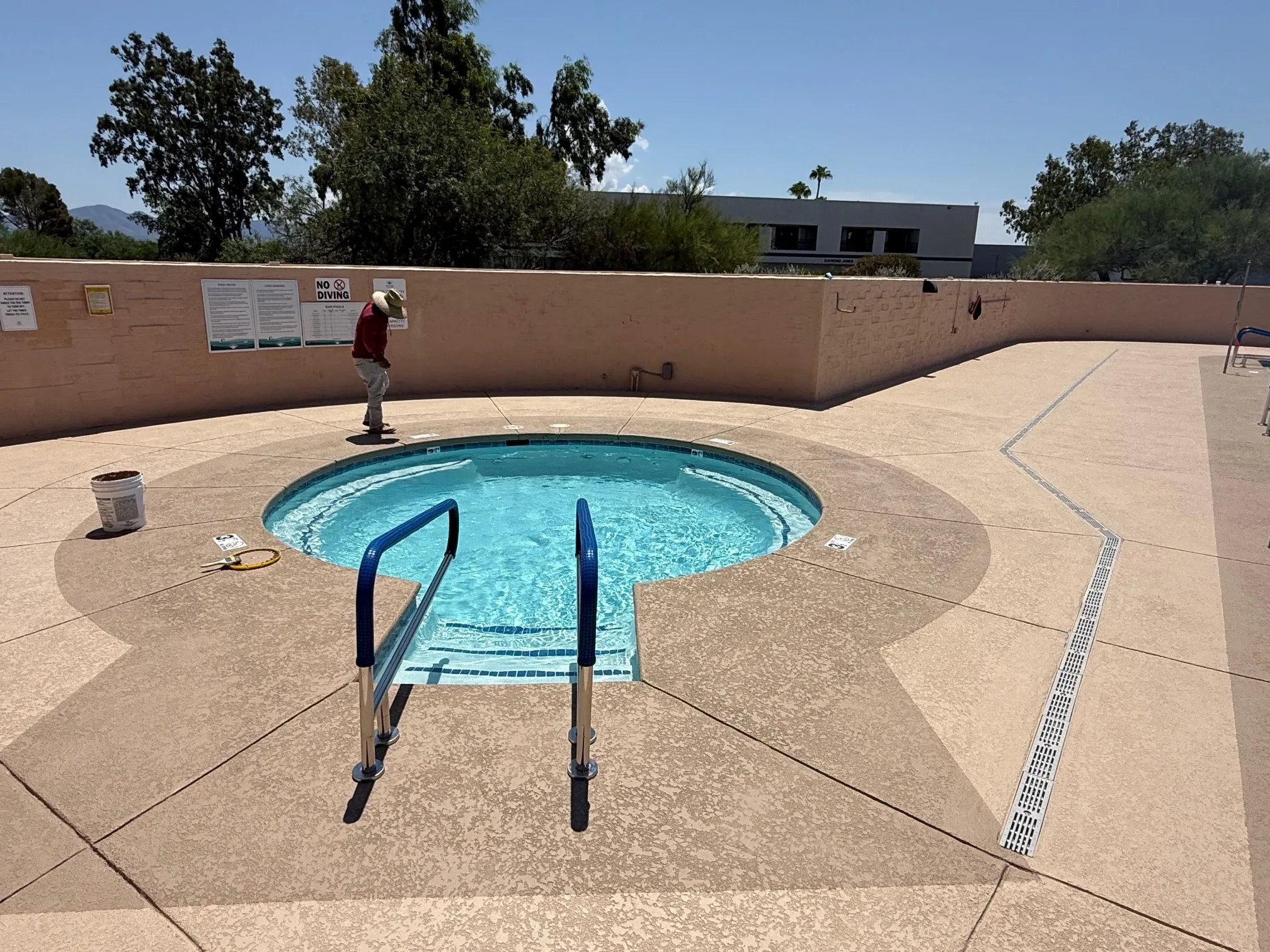 Circular swimming pool with ladder deck