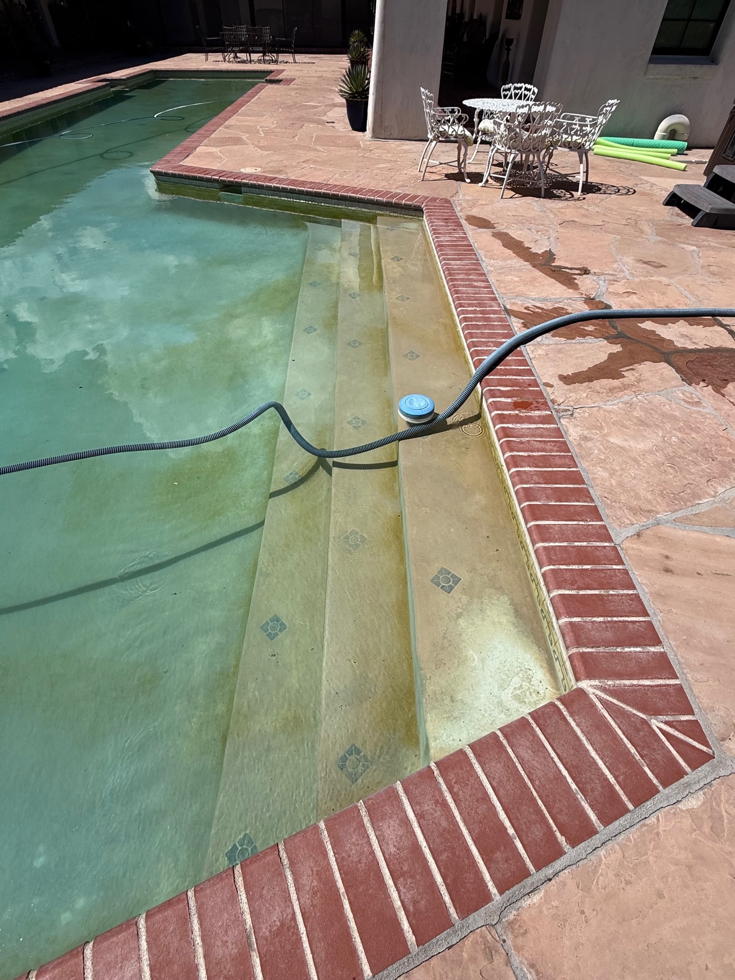 Pool renovation signs — worn plaster and tile
